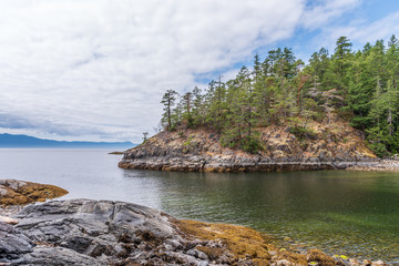 View over Inlet, ocean and island with mountains in beautiful British Columbia. Canada.