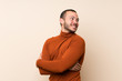 © luismolinero - Colombian man with turtleneck sweater with arms crossed and happy