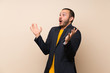 © luismolinero - Colombian man over isolated background with surprise facial expression