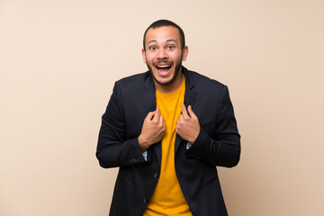 Wall Mural - Colombian man over isolated background celebrating a victory