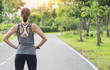 © sutthinon602 - Back view of young fitness woman running on the road in the morning, Young fitness sportswoman runner running on tropical park trail. People and sport concept. Fitness and healthy lifestyle concept.