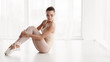 © Prostock-studio - Ballet Dancer Sitting On Floor In Dance Class