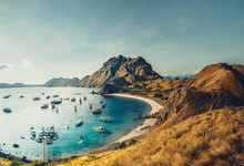 Mountains, Ocean Bay With Boats. Aerial Shot. Padar. Wonderful Panoramic Overview Bay With The Sand Beaches Surrounded By The Mountains. Landscape Of Padar Island. Komodo National Park. Indonesia.