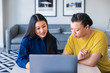 © Lisa Weatherbee - Businesswomen sitting in front of laptop