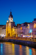 France, Poitou Charentes, La Rochelle, Old Harbour, Porte De La Grosse Horloge At Dusk