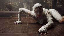 Scary Mummy Creeps On You. The Girl With The Bandage Crawling On The Floor