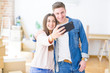 © Krakenimages.com - Beautiful young couple smiling happy taking a selfie photo with smartphone, very excited moving to a new home