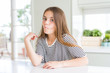 © Krakenimages.com - Beautiful young girl kid wearing stripes t-shirt making fish face with lips, crazy and comical gesture. Funny expression.
