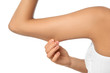 © New Africa - Young woman drawing attention to arm on white background, closeup. Plastic surgery concept