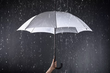Woman Holding White Umbrella Under Rain On Dark Background, Closeup