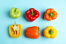 Flat Lay Composition With Ripe Bell Peppers On Blue Background