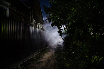Wall Mural - full moon over quite village at night. beautiful night landscape of old town street with lights. rus