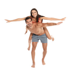 Wall Mural - Young attractive couple in beachwear on white background