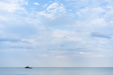 Wall Mural - Landscape of sea and cloudy sky with small island.