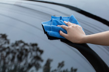 Hand Cleaning Car Using Microfiber Cloth
