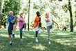 © LIGHTFIELD STUDIOS - multicultural group of pensioners doing exercises on grass