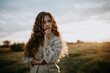 Russian Siberian girl in a field in a summer evening