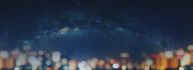 Canvas Print - Blurred night sky full of stars and city Bokeh lights at night. Abstract Bokeh background, with copy space