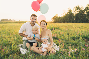 Portrait of family outdoors on nature.