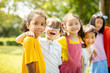 © Tom Wang - Multi-ethnic group of school children laughing and embracing