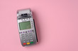 © yuriygolub - POS terminal on pink background