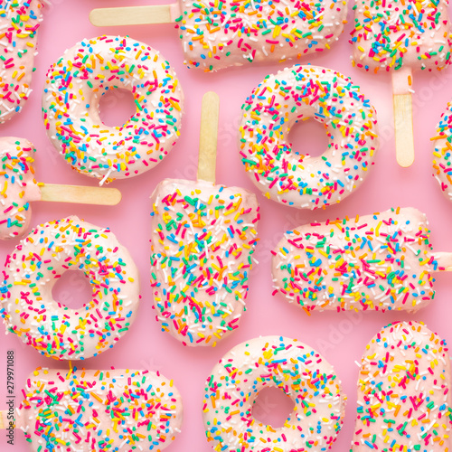 flat lay of creative concept of festive background with popsicles and donuts,...