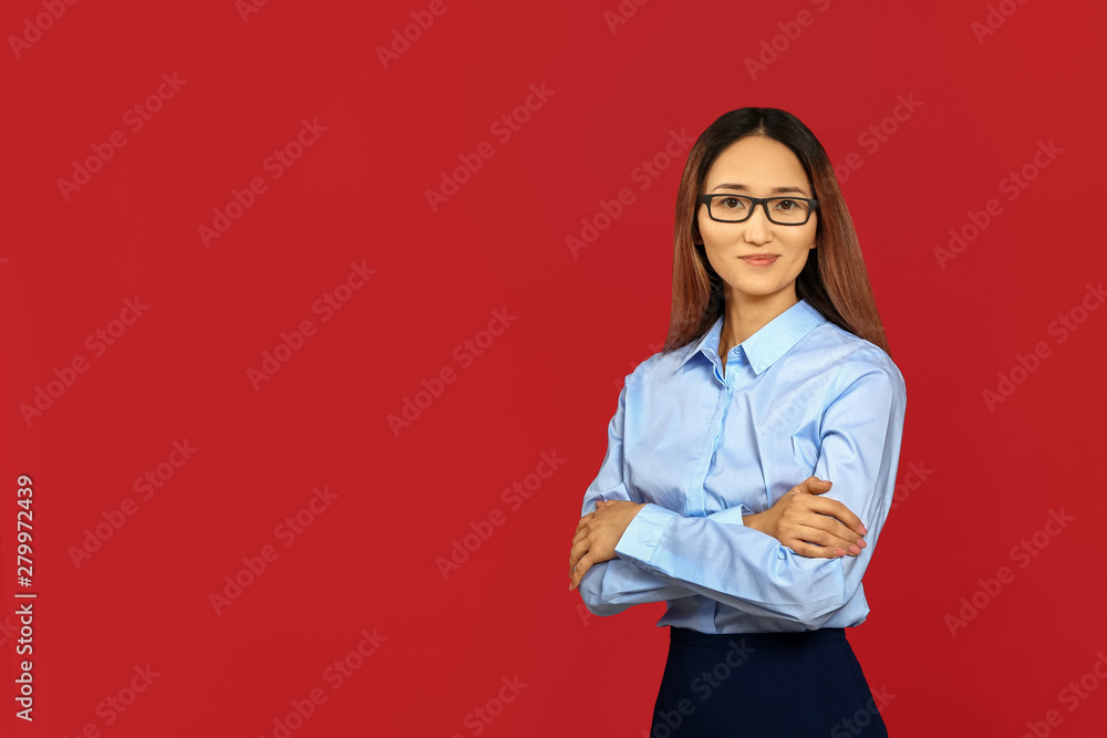 Asian businesswoman on color background