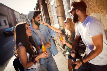 Canvas Print - Group of friends having fun and hanging out outdoors