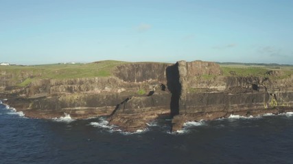 Wall Mural - Aerial Flight view of  Giant's Causeway rocks cliff area during summer sunset time Northern Ireland