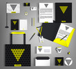 Black corporate identity with a yellow triangle.