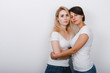 © speed300 - Portrait of two adorable women friends gently embracing Happy young sisters showing strong friendship