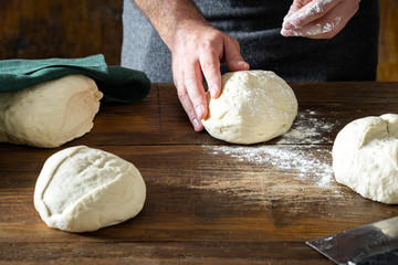 Canvas Print - Man preparing dough for cooking homemade bread