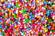 © Katerina Schneider - Bright colorful plastic perler beads. Abstract background