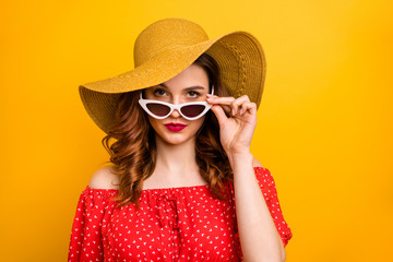 Wall Mural - Pretty lady look window dislike rainy weather wear red dress sun specs and hat isolated yellow background