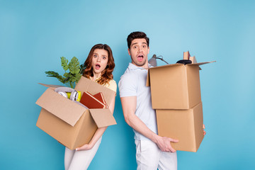 Poster - Portrait of his he her she nice attractive sad unhappy upset worried scared afraid people carrying big large boxes packages old buyings isolated over bright vivid shine blue green background