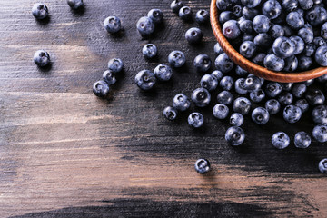 Wall Mural - Perfectly ripe freshly picked local produce blueberries. Close up, copy space for text, top view, background. Healthy vegan snacks full of antioxidants. Seasonal summer berries.