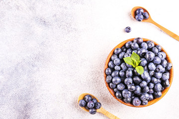 Wall Mural - Perfectly ripe freshly picked local produce blueberries. Close up, copy space for text, top view, background. Healthy vegan snacks full of antioxidants. Seasonal summer berries.