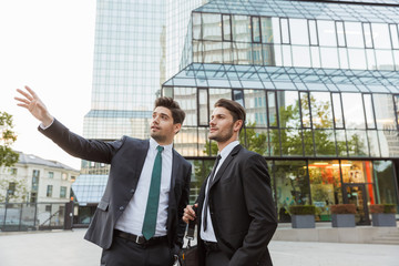 Sticker - Two attractive young businessmen wearing suits