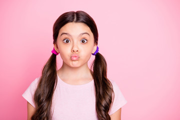 Canvas Print - Portrait of cute child with lips pouted plump making faces wear white t-shirt isolated over pink background