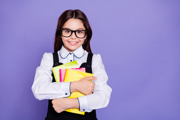 Canvas Print - Close-up portrait of nice attractive cheerful cheery diligent intellectual wavy-haired pre-teen girl holding in hands academic literature isolated over bright vivid shine violet background