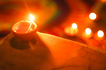 Canvas Print - celebration of Indian festival Diwali - oil lamps lit on colorful rangoli