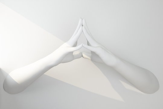 two white hands fastened in a gesture of prayer