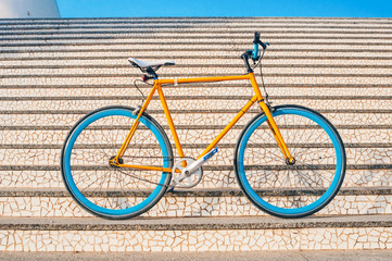 Wall Mural - Old yellow fixed gear bicycle on a stairs