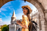 Fototapeta Natura - A young woman enjoying her trip to the Castle of Budapest