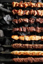 Set Of Shish Kebabs Barbecue Shashlik On Charcoal Background