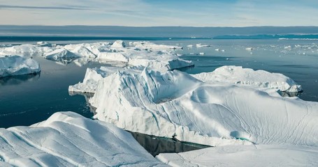 iceberg aerial footage - giant icebergs in disko bay on greenland floating in ilulissat icefjord fro