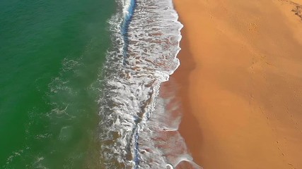 Wall Mural - Aerial footage from Spanish beach and waves, slow motion