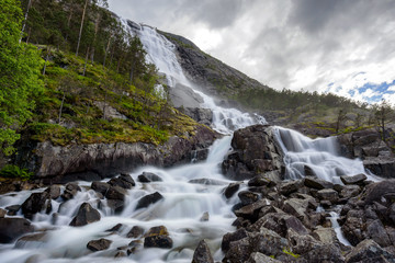 Wall Mural - With a total drop of 612 metres, Langfoss (Langfossen) is the fifth highest waterfall in Norway.