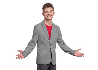 Poster - Handsome caucasian Teen Boy in gray suit isolated on white background. Teenager looking at camera and smiling. Happy child - portrait.