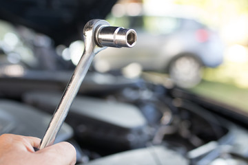 Canvas Print - hand with automotive mechanic tool